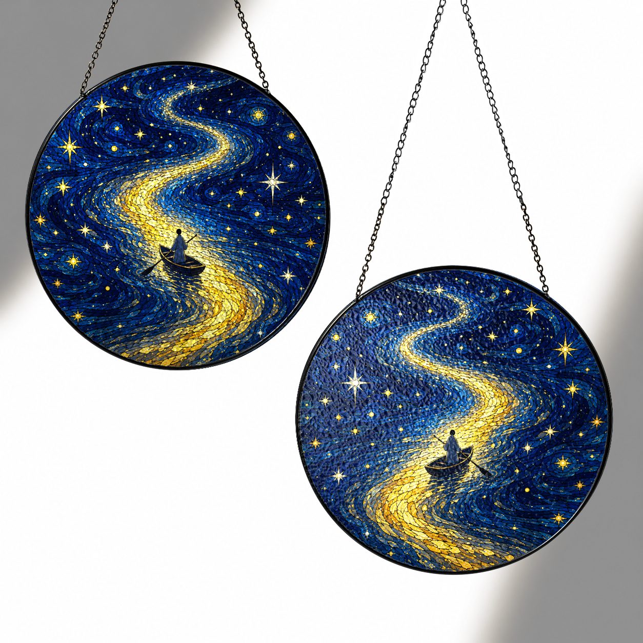 Two sizes of the rowboat suncatcher side by side