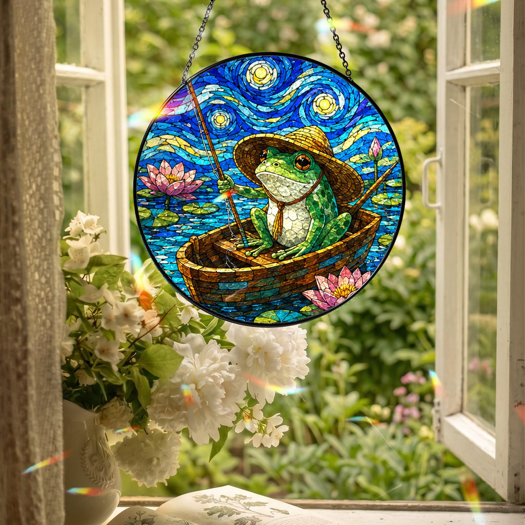 Fishing frog suncatcher hanging in an open window