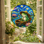Fishing frog suncatcher hanging in an open window