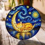 Cat on crescent moon suncatcher on a wooden table in sunlight