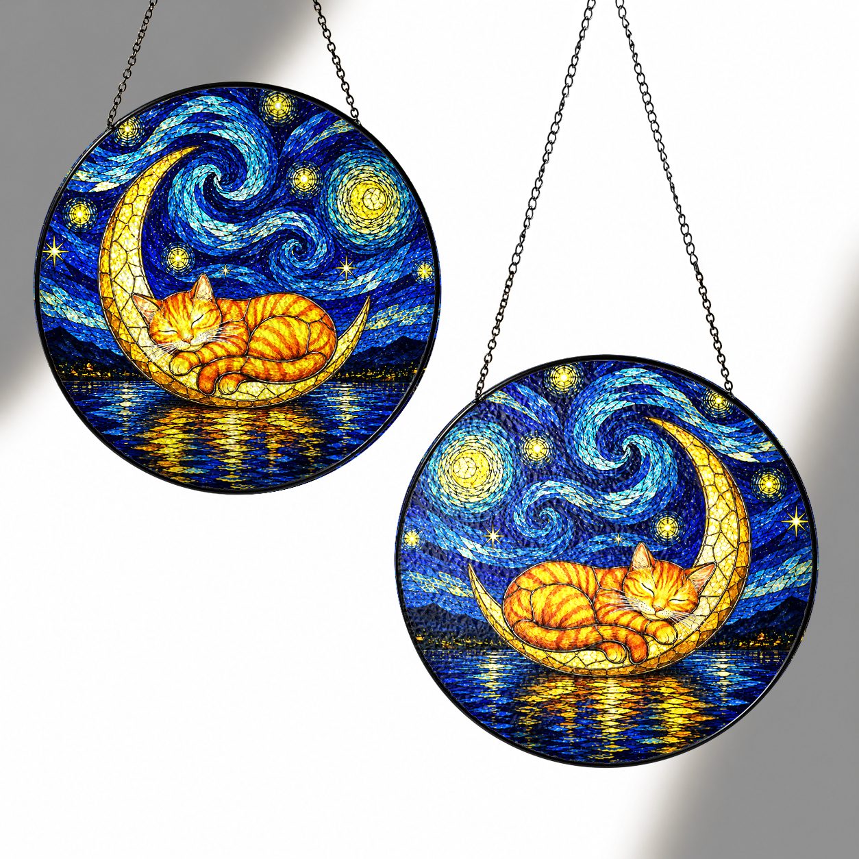 Two sizes of the cat moon suncatcher side by side