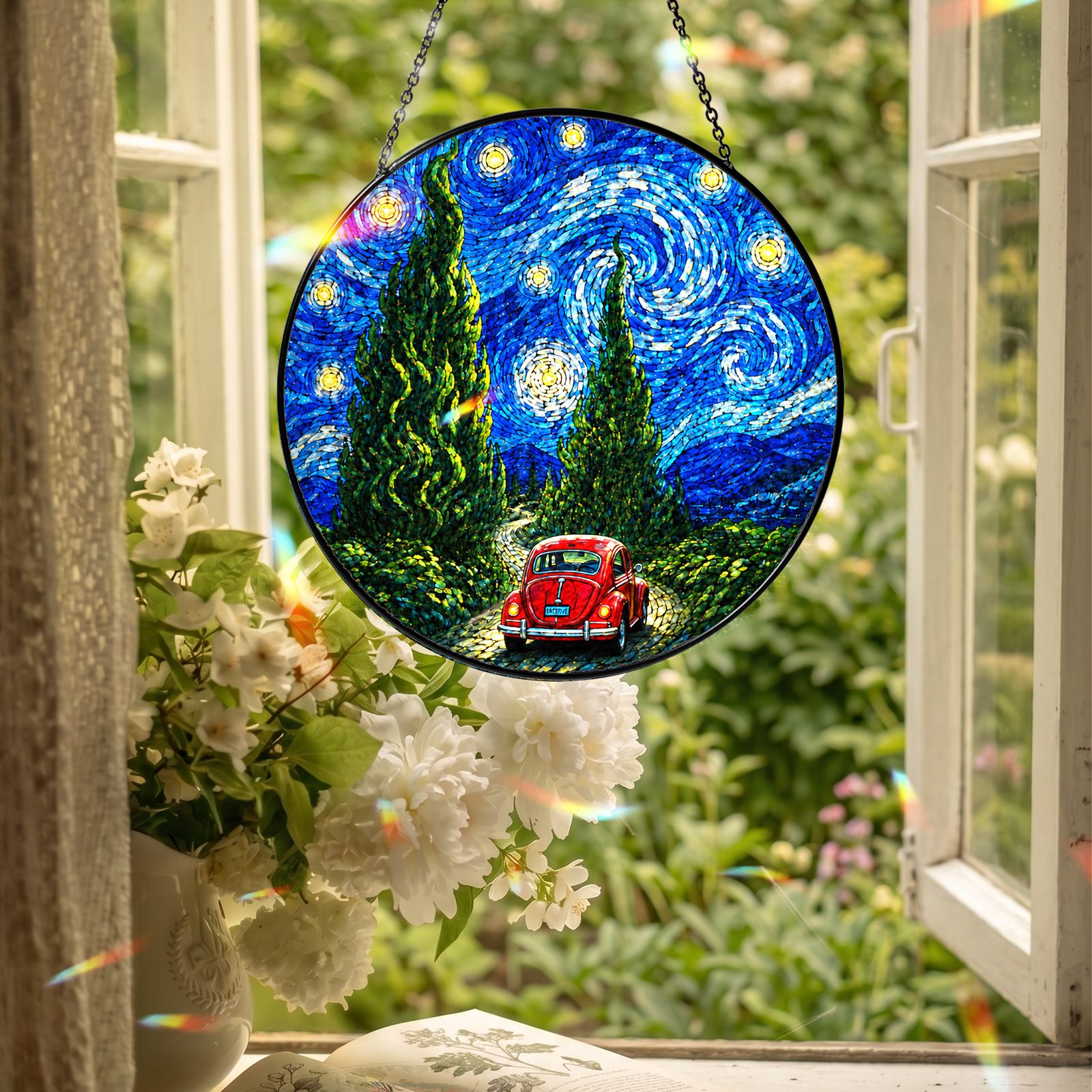 Red car suncatcher hanging in an open window