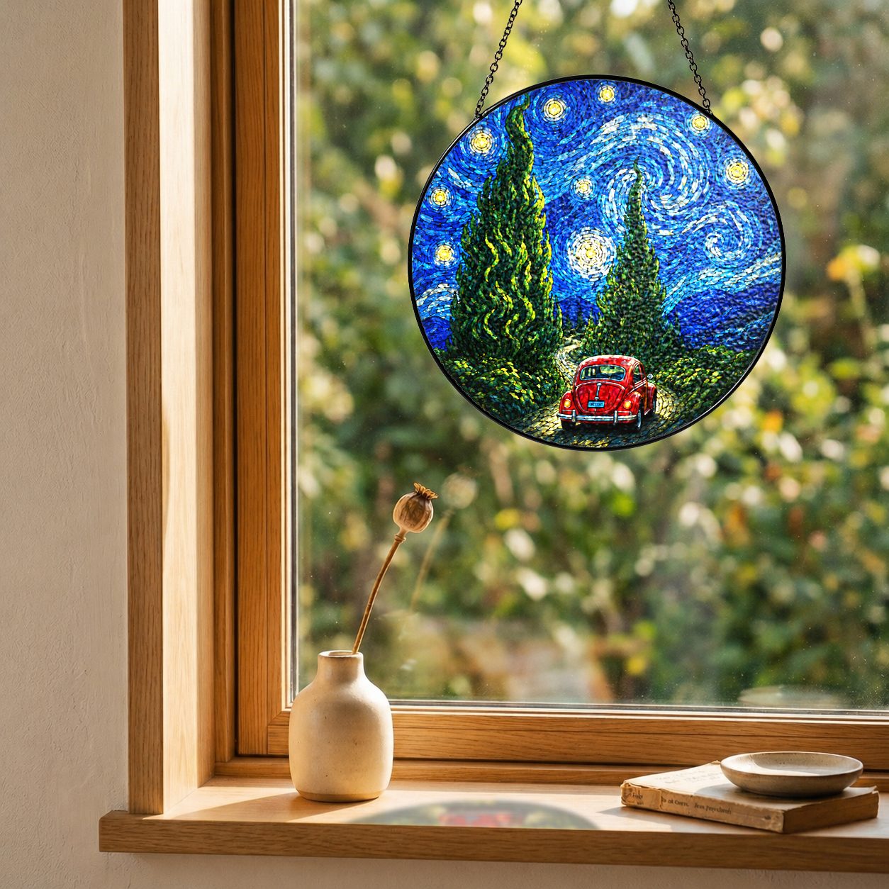 Red car suncatcher on a windowsill