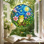 Frog blossom suncatcher in a reading nook window