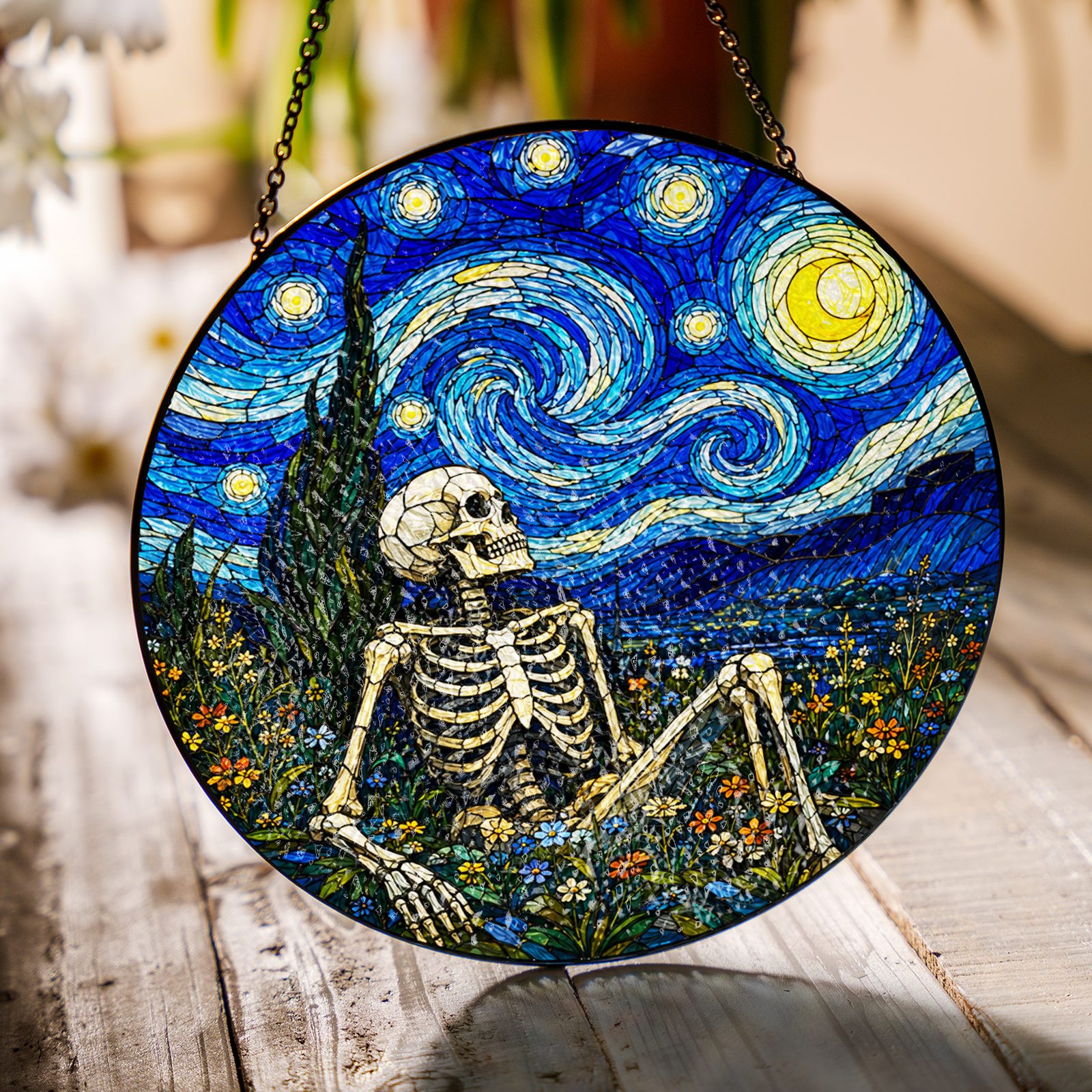 Skeleton flower field suncatcher on a wooden table in sunlight