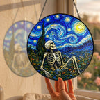 Hand holding the skeleton suncatcher at a window
