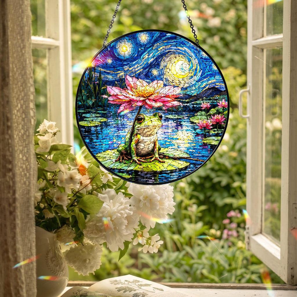 Frog lotus suncatcher hanging in an open window