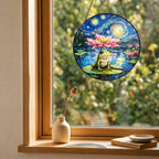Frog lotus suncatcher on a windowsill