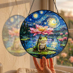 Hand holding the frog lotus suncatcher at a window