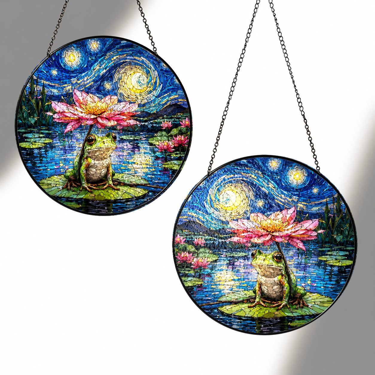 Two sizes of the frog lotus suncatcher side by side