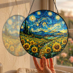 Hand holding the sunflower field suncatcher at a window