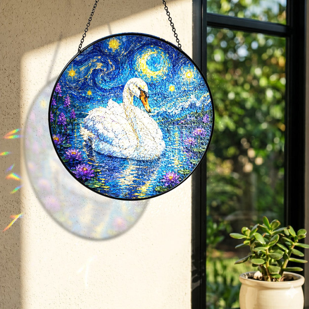 Rainbow light cast by the swan stained glass suncatcher