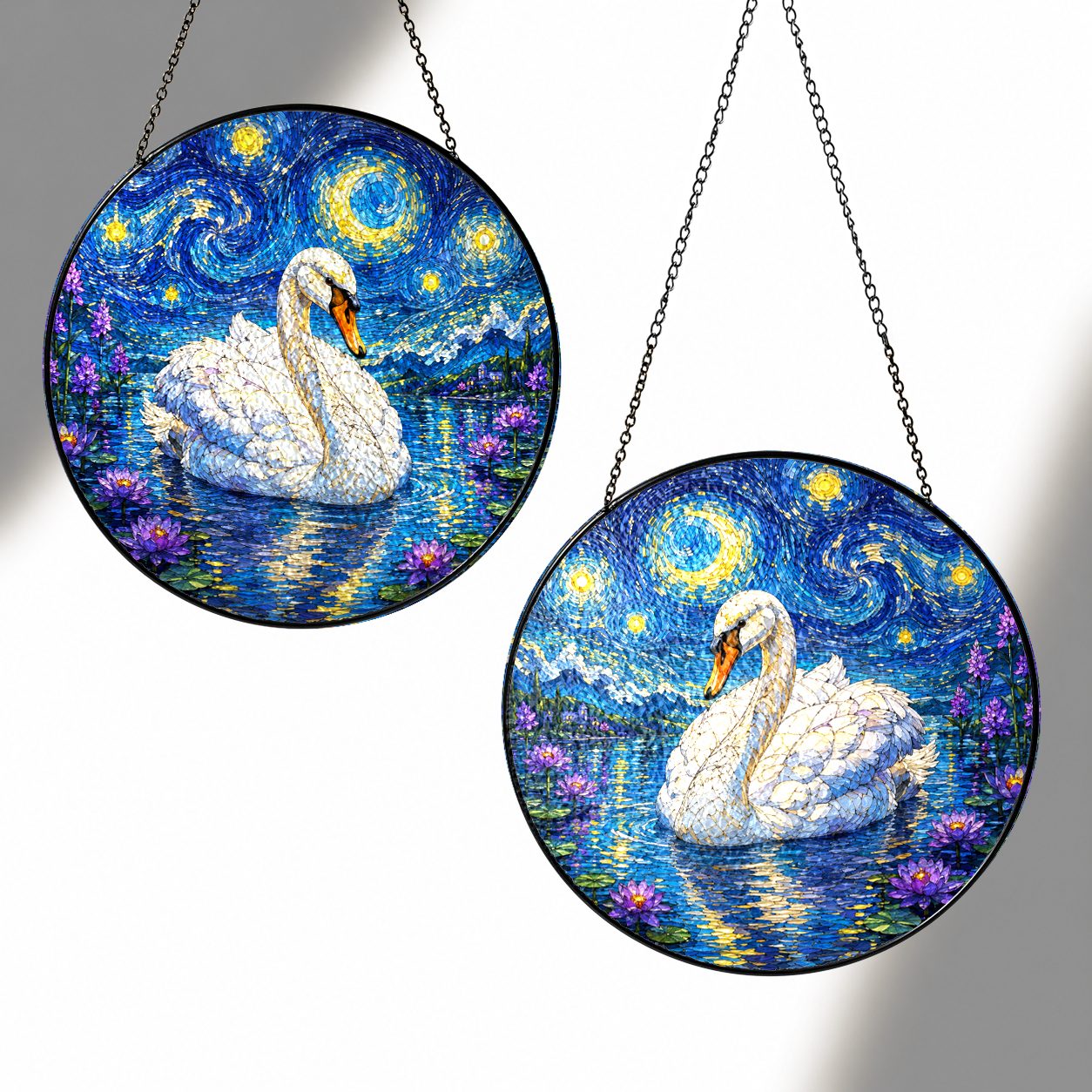 Two sizes of the swan suncatcher side by side