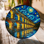 Stone aqueduct suncatcher on a wooden table in sunlight