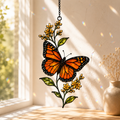 Monarch butterfly yellow wildflower suncatcher on a bright windowsill