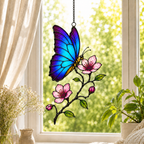 Blue morpho butterfly and pink blossom holographic acrylic suncatcher in a sunlit window