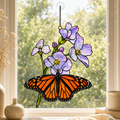 Monarch butterfly and purple blossom bouquet holographic acrylic suncatcher in a sunlit window