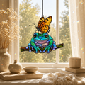 Frog and monarch butterfly suncatcher with books and ceramics