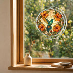 Orange hibiscus hummingbird acrylic puzzle suncatcher hanging in a cozy wooden window corner with natural light.