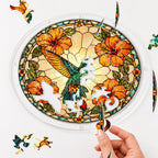 Hand placing a puzzle piece into the Sunburst Hibiscus Hummingbird acrylic puzzle suncatcher.