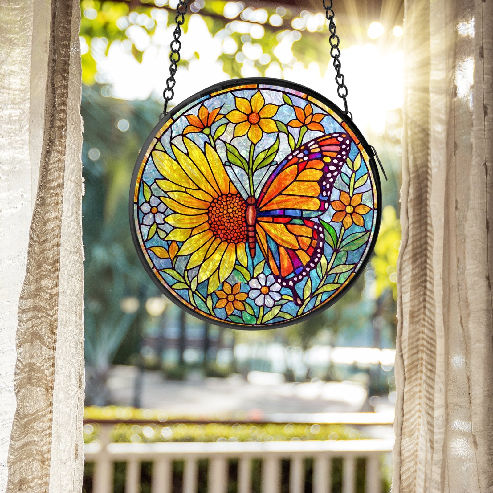 Sunflower butterfly stained glass suncatcher held in hand