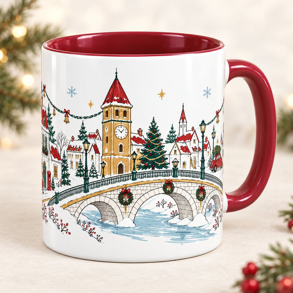 The Christmas Promenade mug, clock tower side: snowy village with an ochre clock tower, Christmas tree and stone bridge over an icy river, red handle and red inside