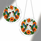 Two orange flower hummingbird acrylic puzzle suncatchers hanging together to show size options