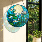 White lotus suncatcher near a window with colorful light reflection on the wall